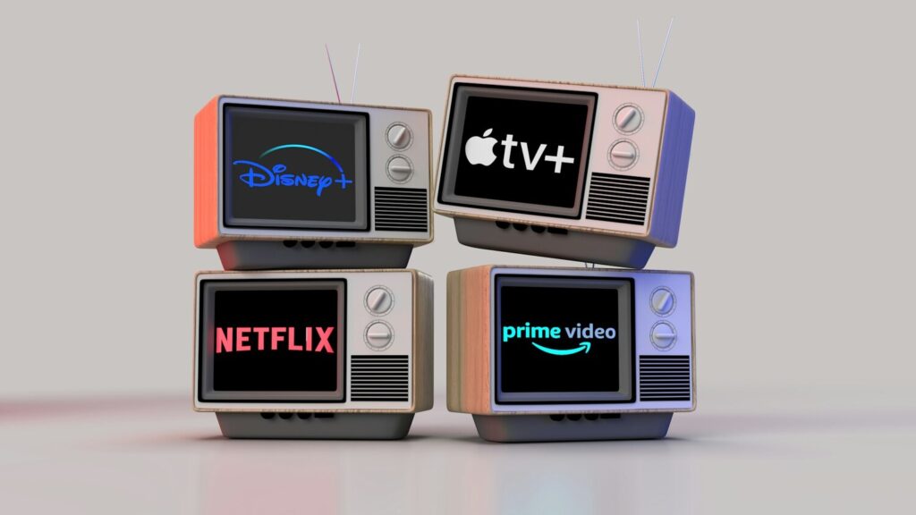 Stack of four retro TV sets displaying Disney+, Apple TV+, Netflix, and Prime Video logos, representing the walled gardens of streaming platforms