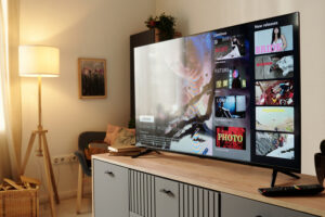 Smart TV in a living room displaying a streaming interface, representing how CTV advertising platforms deliver ads on connected television