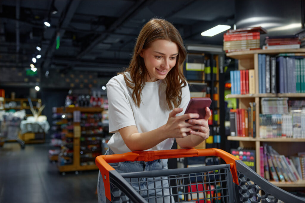 Shopper browsing a retail app on a phone in store