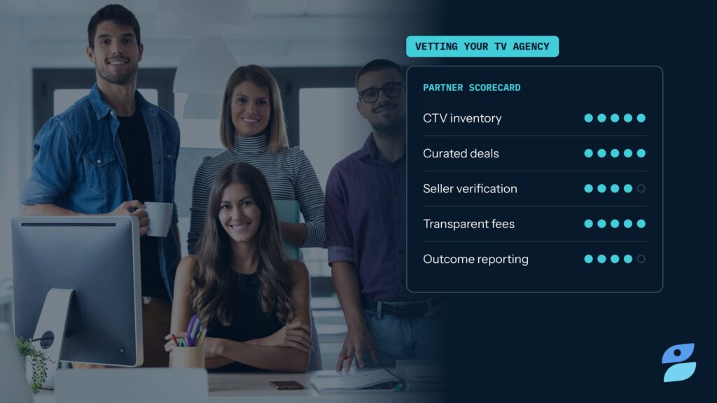 A smiling marketing team next to a partner scorecard, illustrating how to choose a TV ad agency.