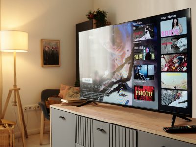 Smart TV in a living room displaying a streaming interface, representing how CTV advertising platforms deliver ads on connected television